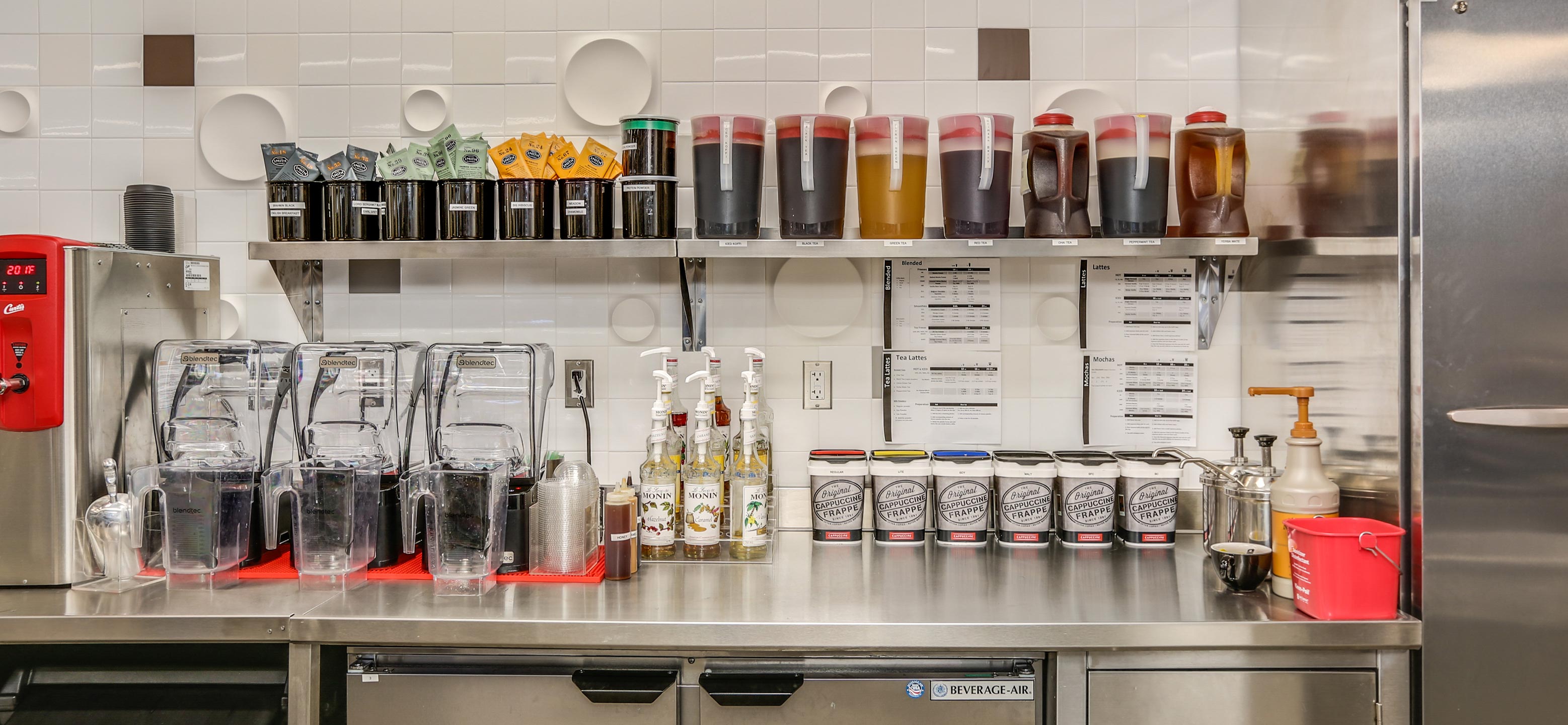 A spread of various ingredients used to make specialty drinks by Koffi Coffee