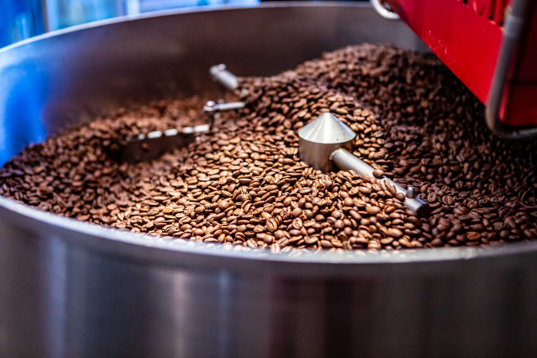 Coffee beans being circulated through a large coffee roaster