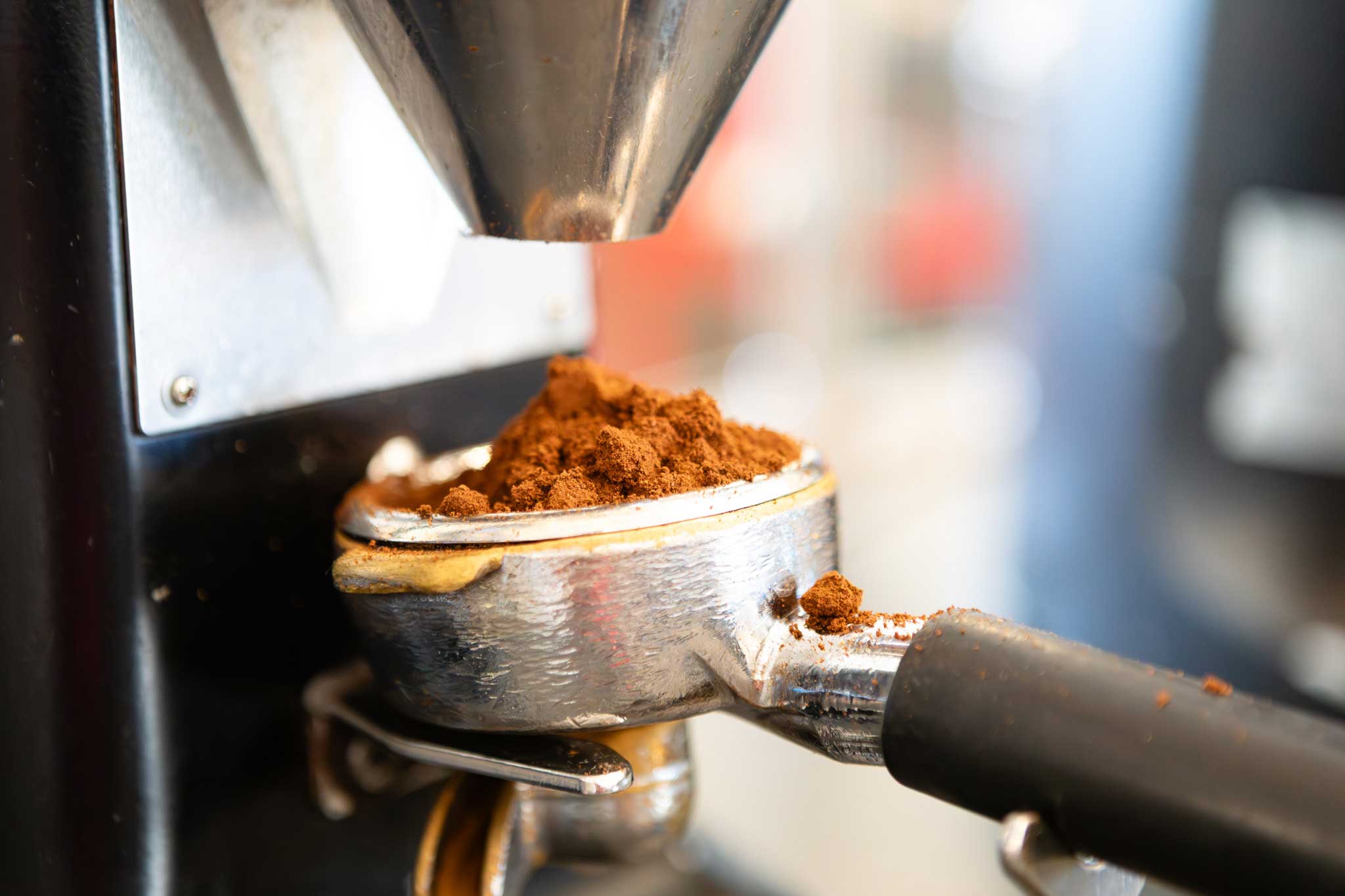 Finely ground coffee displayed in an espresso portafilter.