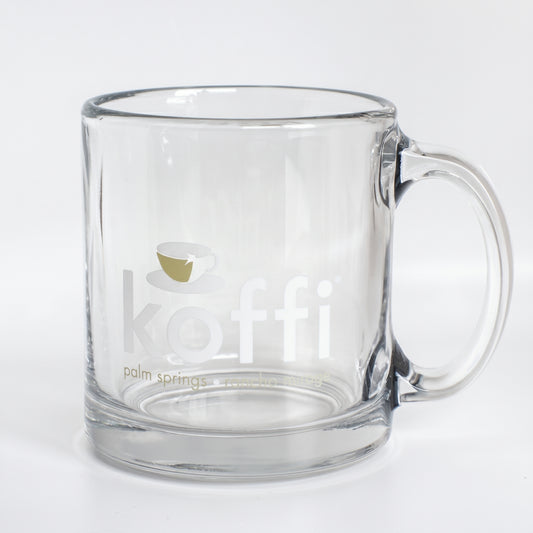 Clear glass mug with 'koffi' branding on a white background